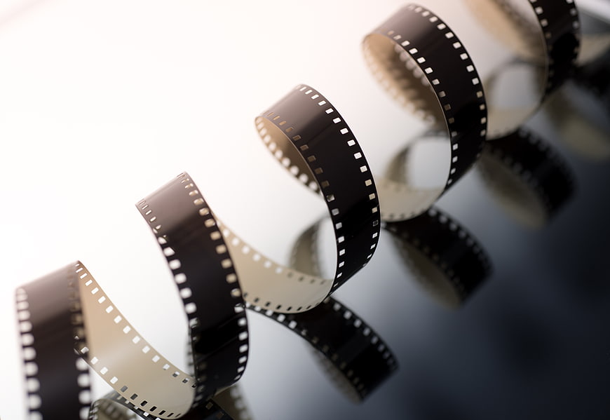 Vintage Film Strip on Reflective Surface