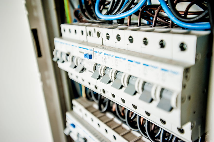 Close-up of electrical circuit breakers and wiring in a distribution board