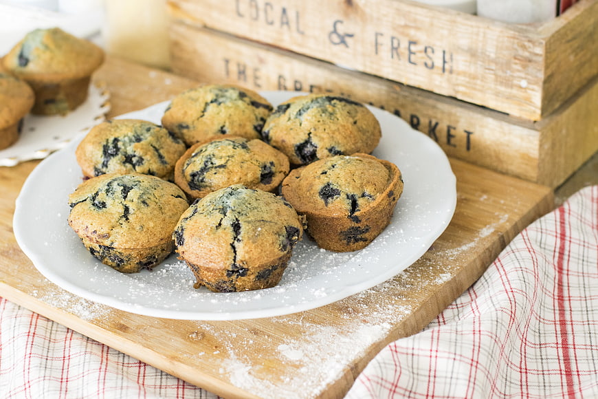 Fresh Blueberry Muffins on White Plate with Rustic Wooden Crate