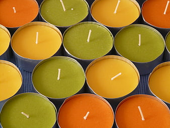 Top View of Colorful Tea Light Candles in Tin Containers
