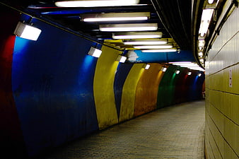 Colorful Curved Subway Tunnel with Blue and Yellow Walls