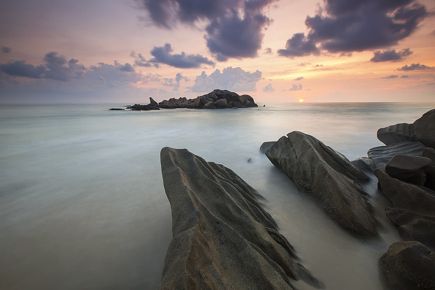 Long Exposure Sunset Over Rocky Coastal Landscape