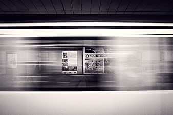 Motion blur of a subway train passing through a station