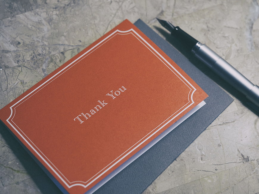 Orange Thank You Card with Fountain Pen on Marble