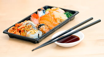 Sushi Takeout Box with Chopsticks and Soy Sauce