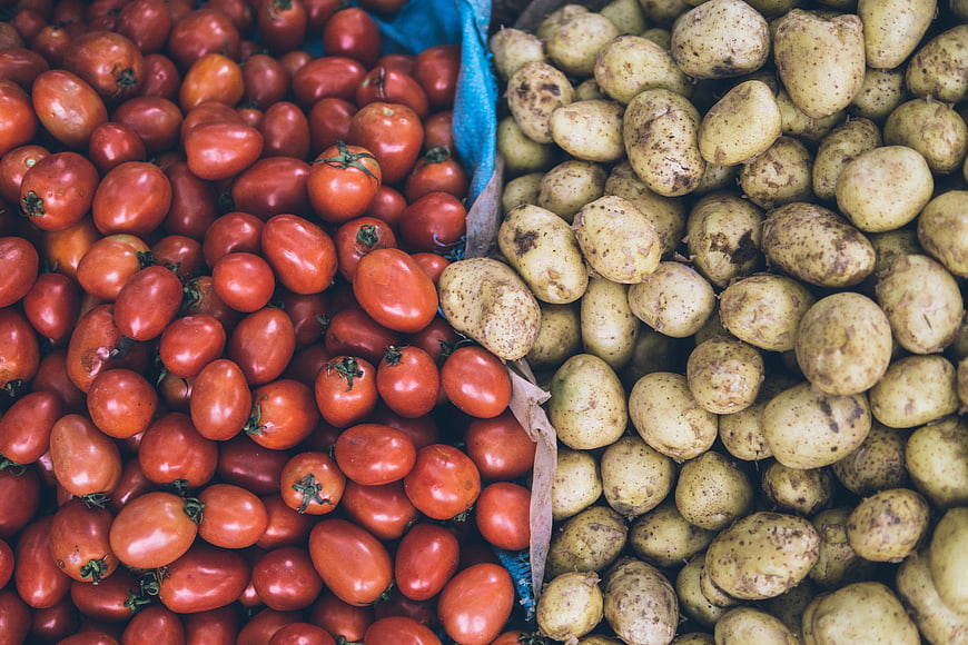 Fresh Roma Tomatoes and Potatoes Market Display