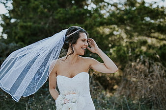 Happy Bride Laughing with Vein Blowing in Wind