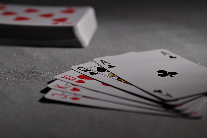Royal Flush Poker Hand on Gray Table