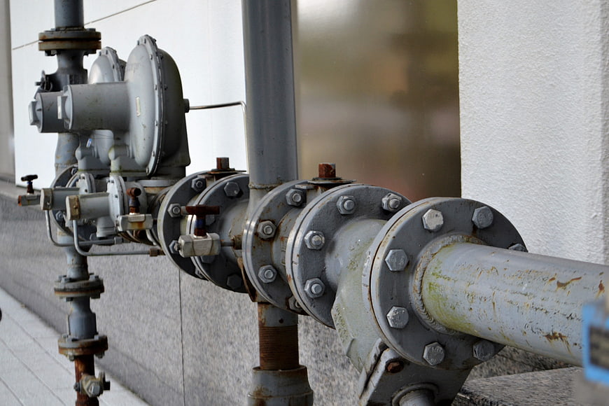 Close-up of industrial gray metal pipes and valves