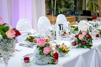 Elegant Wedding Reception Table Setting with Floral Centerpieces