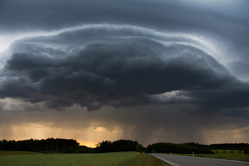 Dramatic Shelf Cloud Over Rural Highway Landscape