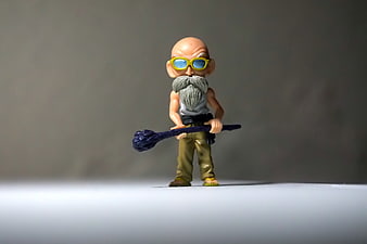 Dragon Ball Master Roshi Action Figure on Gray Background