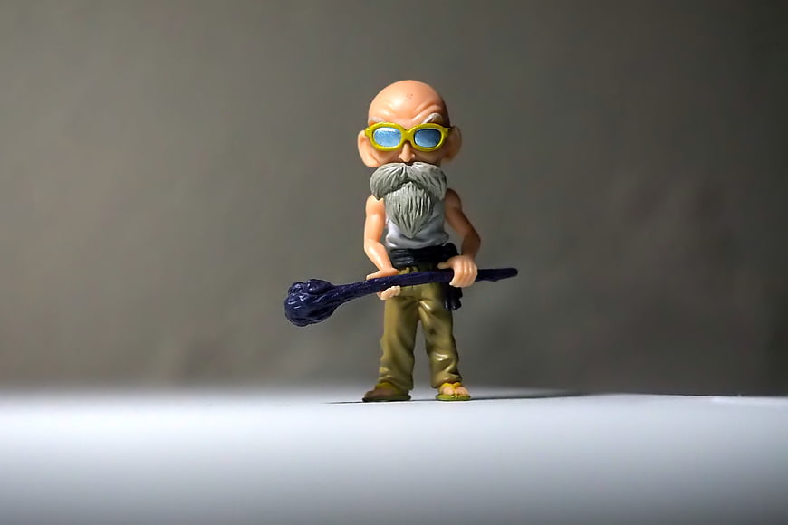 Dragon Ball Master Roshi Action Figure on Gray Background
