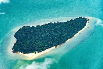 Aerial View of Heart-Shaped Tropical Island in Turquoise Ocean