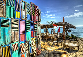 Colorful Beach Lounge with Vibrant Shutters and Ocean View