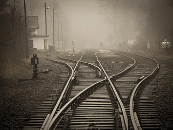 Foggy Railroad Tracks with Switches in Sepia Tone