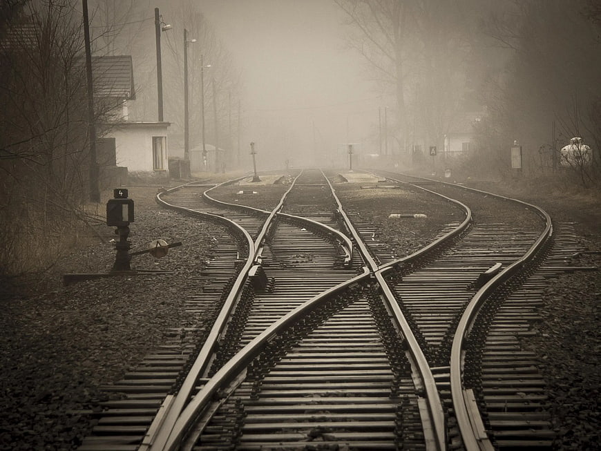 Foggy Railroad Tracks with Switches in Sepia Tone