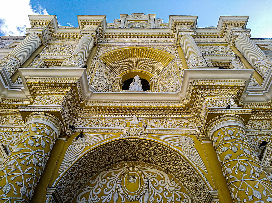 Yellow and white baroque church facade in Guatemala