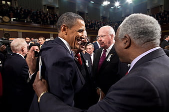 Barack Obama laughing with senators during State of the Union address