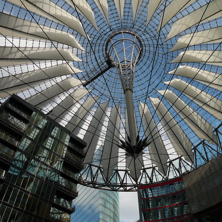 Modern glass canopy architecture with white tensile fabric roof