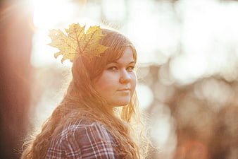 Woman with Autumn Leaf in Hair Backlit Portrait