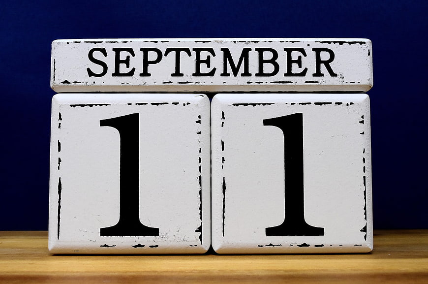 Vintage Wooden Blocks Displaying September 11 Date on Blue Background