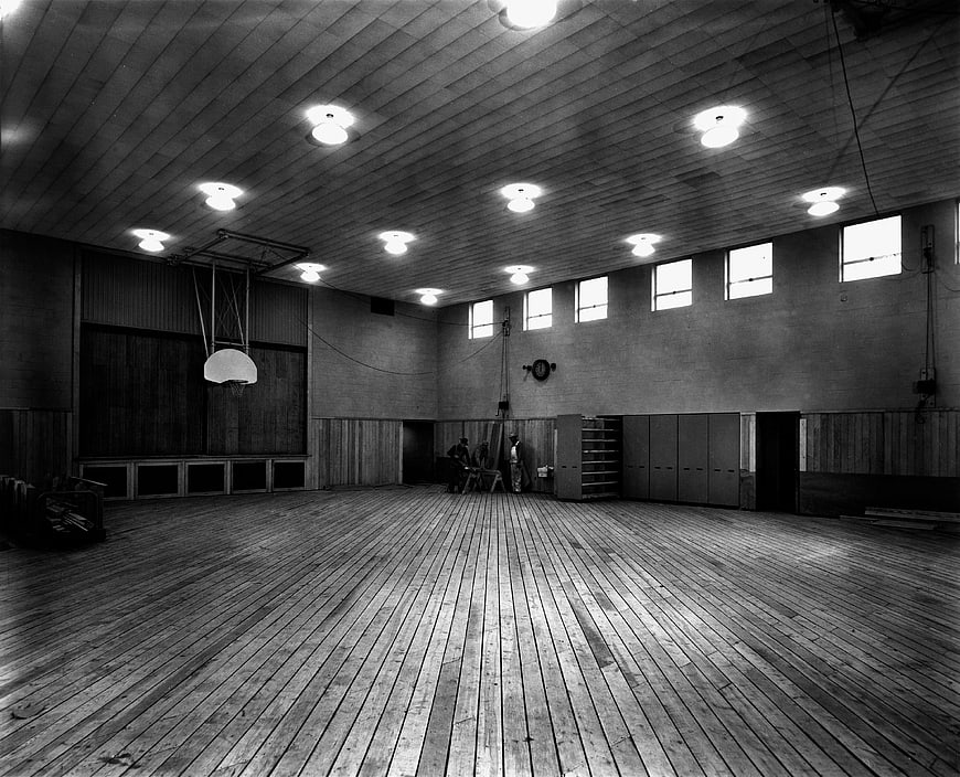 Vintage Black and White Gymnasium Interior with Wooden Floor