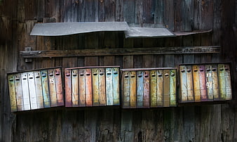 Rusty vintage mailboxes on weathered wooden wall