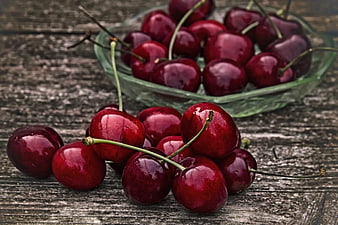 Fresh Ripe Red Cherries on Rustic Wooden Table