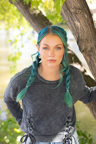 Portrait of Woman with Blue Braided Hair Outdoors
