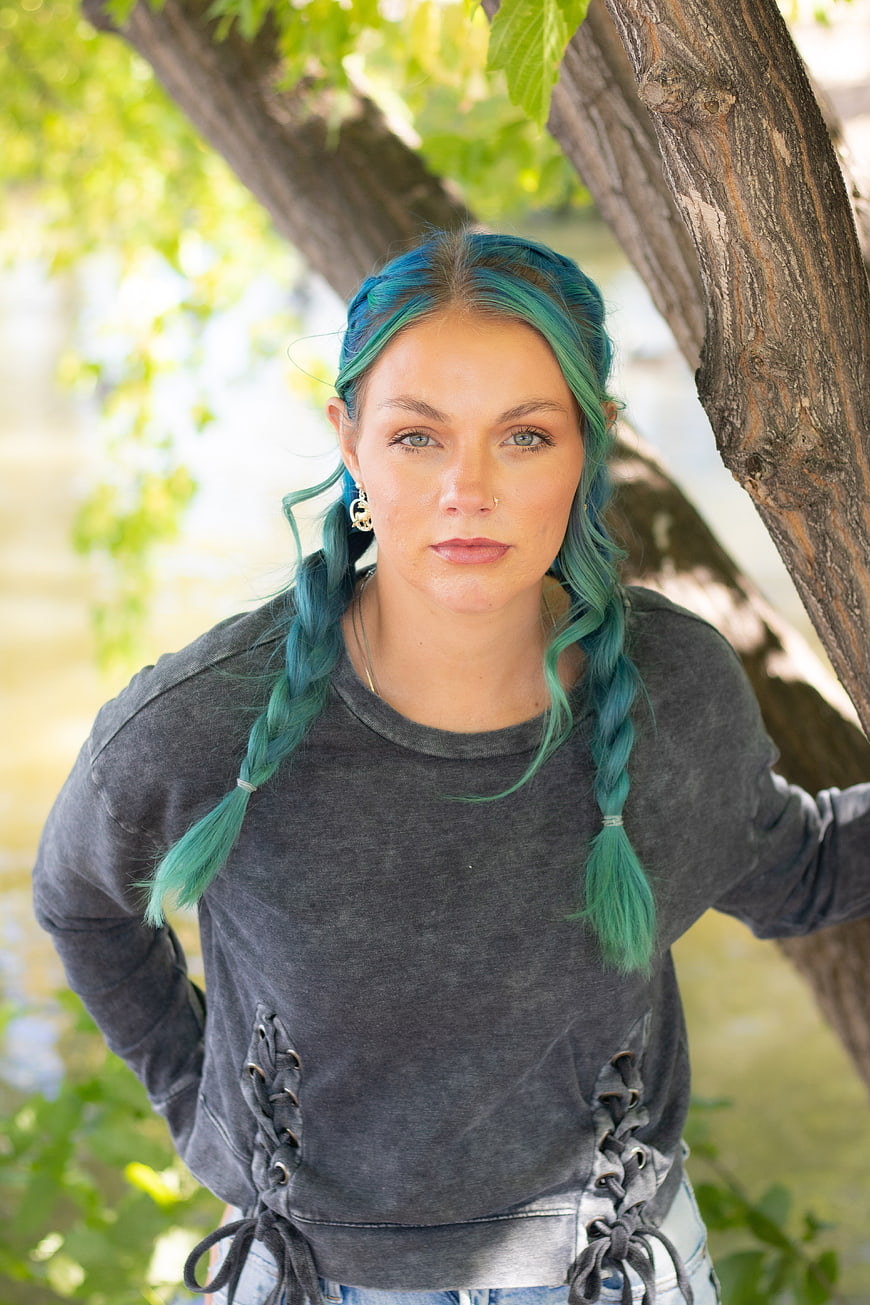 Portrait of Woman with Blue Braided Hair Outdoors