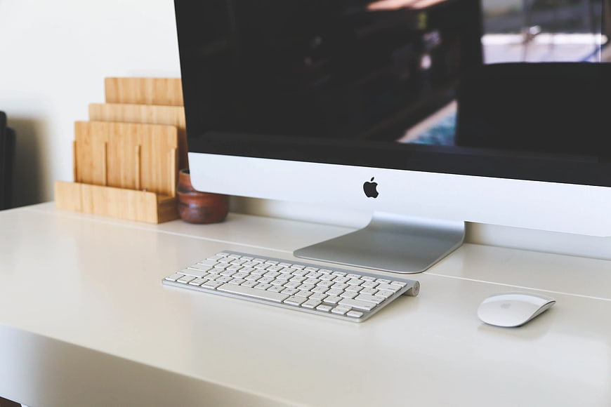 Minimalist White Desk with Apple iMac and Wooden Organizer