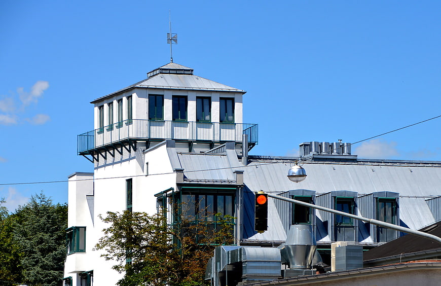 White Art Deco Building with Control Tower and Blue Sky