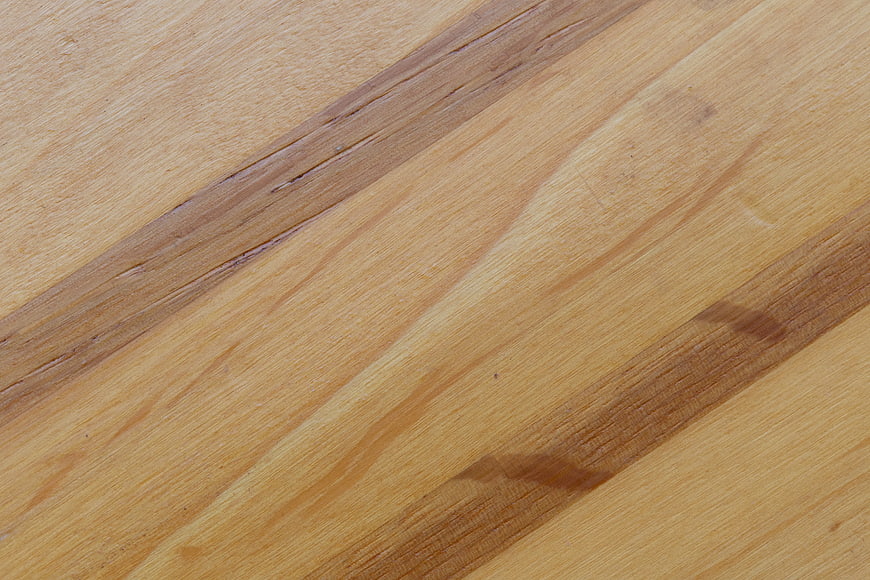 Close-up of natural wood grain texture with diagonal lines
