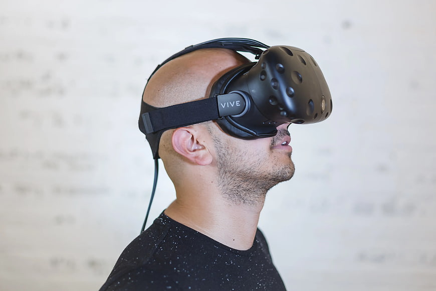 Man wearing black VR headset in profile