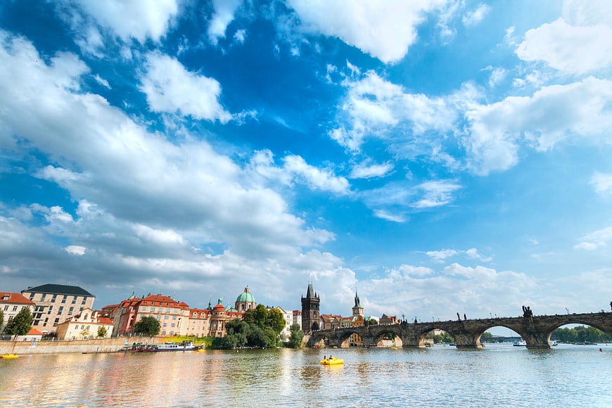 Charles Bridge Prague Skyline with Blue Sky and Clouds
