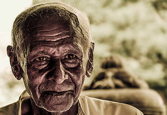 Close-up portrait of an elderly man with a serious expression