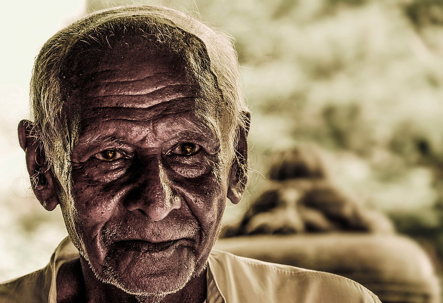 Close-up portrait of an elderly man with a serious expression