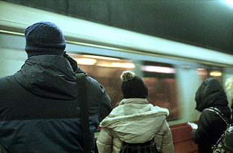 Commuters waiting for subway train in underground station
