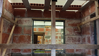 Interior view of brick wall construction with scaffolding