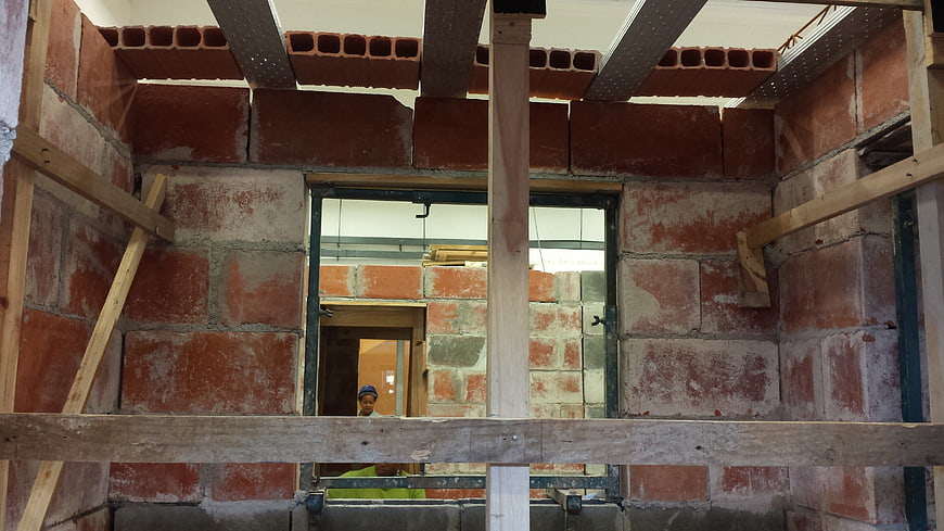 Interior view of brick wall construction with scaffolding