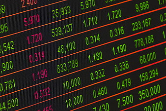 Close-up of digital stock market exchange board with financial data