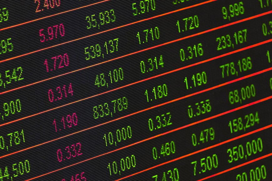Close-up of digital stock market exchange board with financial data