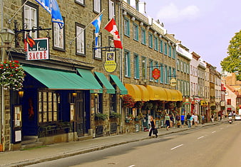 Historic Stone Buildings and Flags on Old Quebec City Street