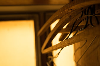 Close-up of wooden clothes hangers in a closet