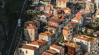 Aerial View of Colorful Houses and Funicular Railway on Steep Hillside