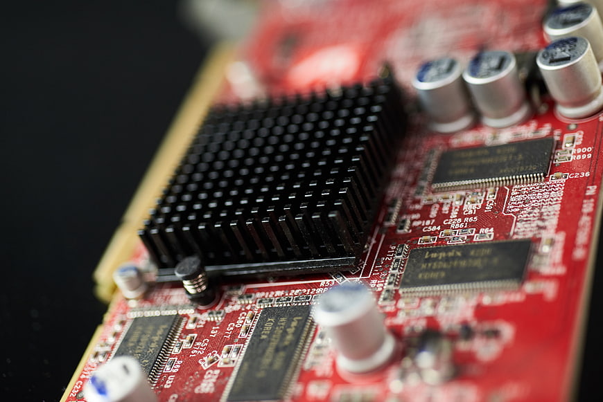 Close-up of red computer graphics card circuit board