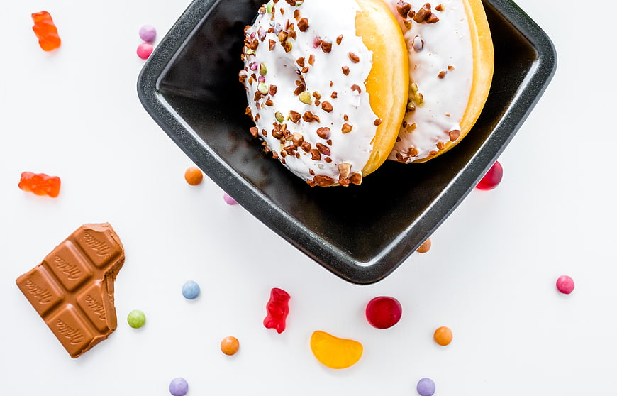 Top View of Glazed Donuts with Chocolate and Gummy Bears