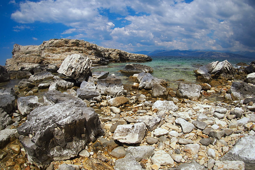 Rugged Rocky Coastline with Turquoise Sea and Blue Sky