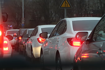White cars in traffic jam with brake lights